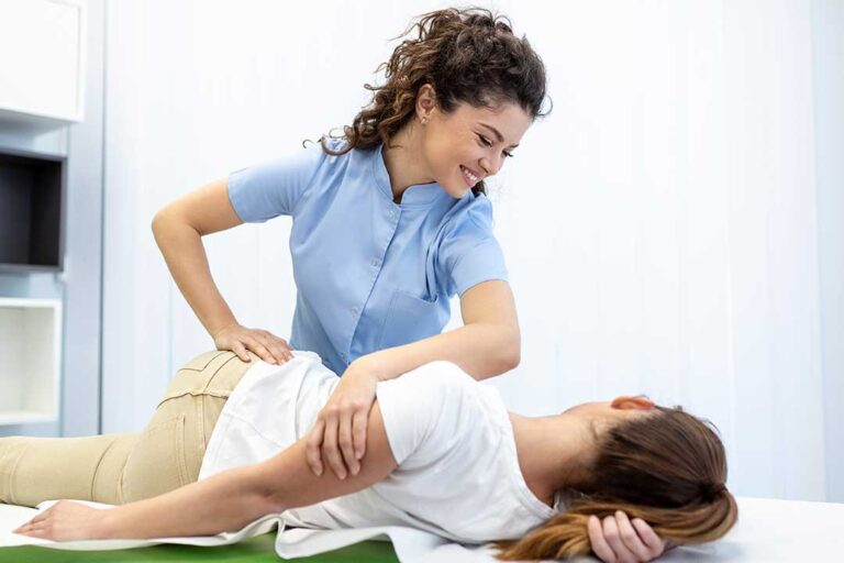 A person receiving a gentle spinal assessment in a healthcare clinic setting.